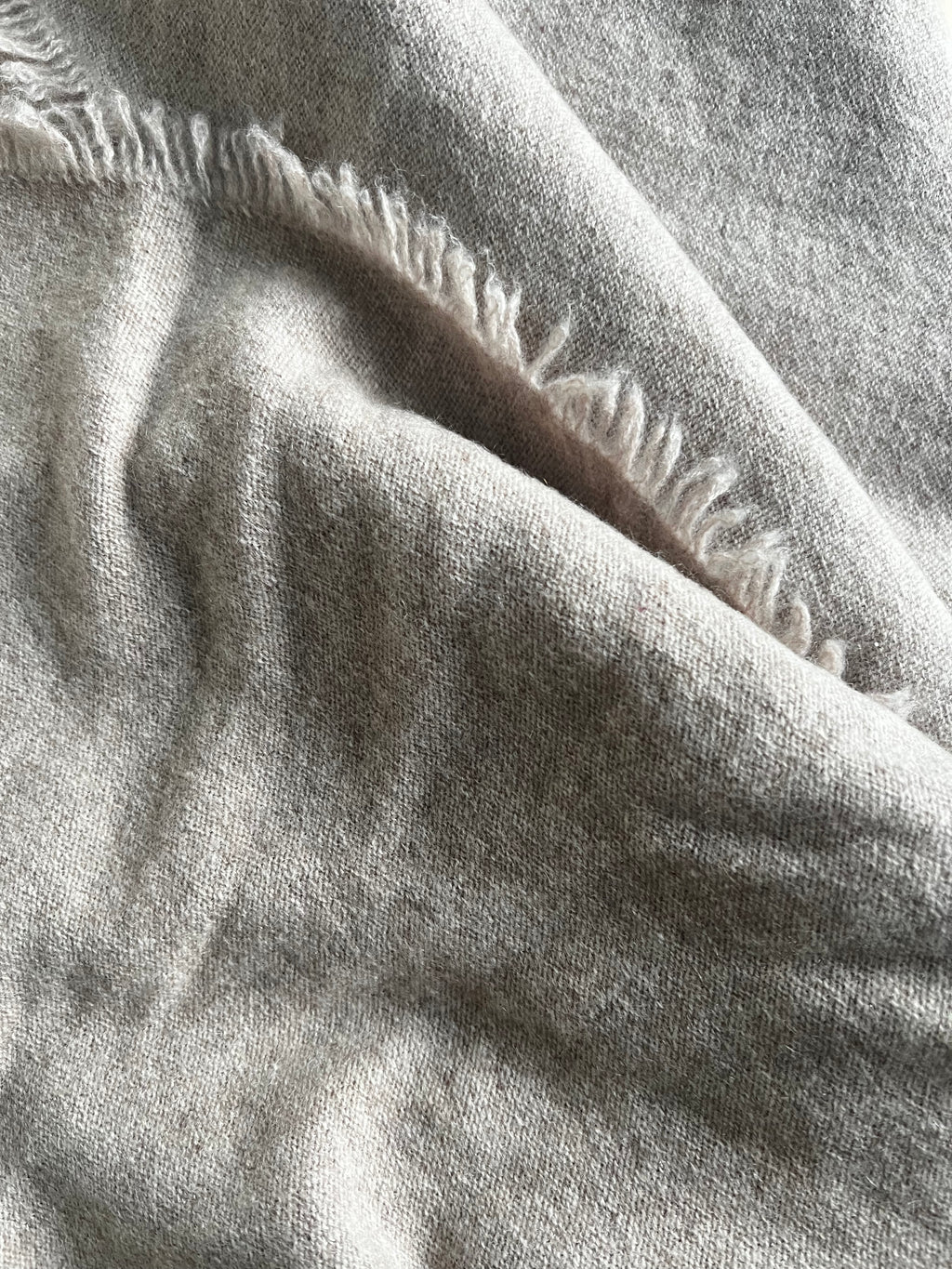 Close-up of textured fabric with visible stitching and weaving